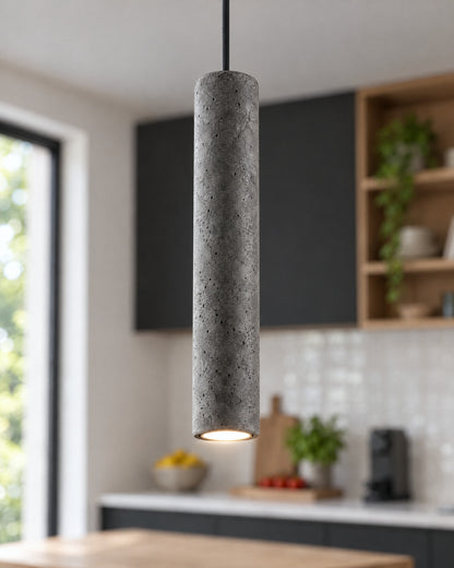 Détail du cylindre en béton de la suspension Luvo dans une cuisine
